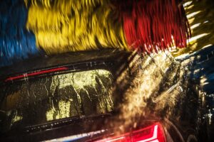 economy car going through an automatic car ash