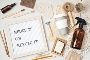 reuse it or refuse it on a letter box with eco-friendly products around