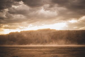 dust storm in canyon with sunrise