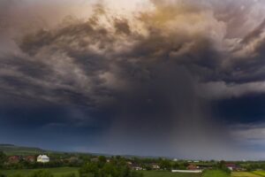 dark clouds storming over farmland