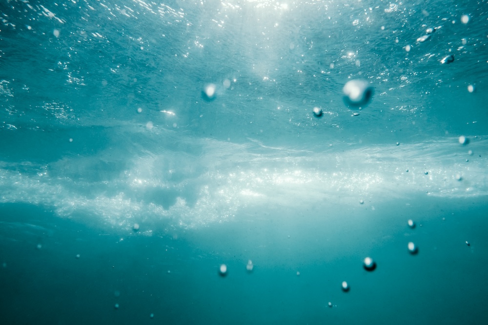 underwater view of deep ocean bubbles