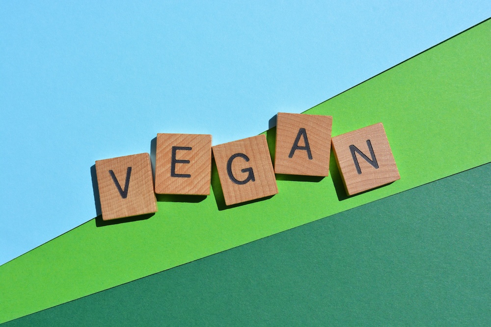 wooden letters spelling vegan