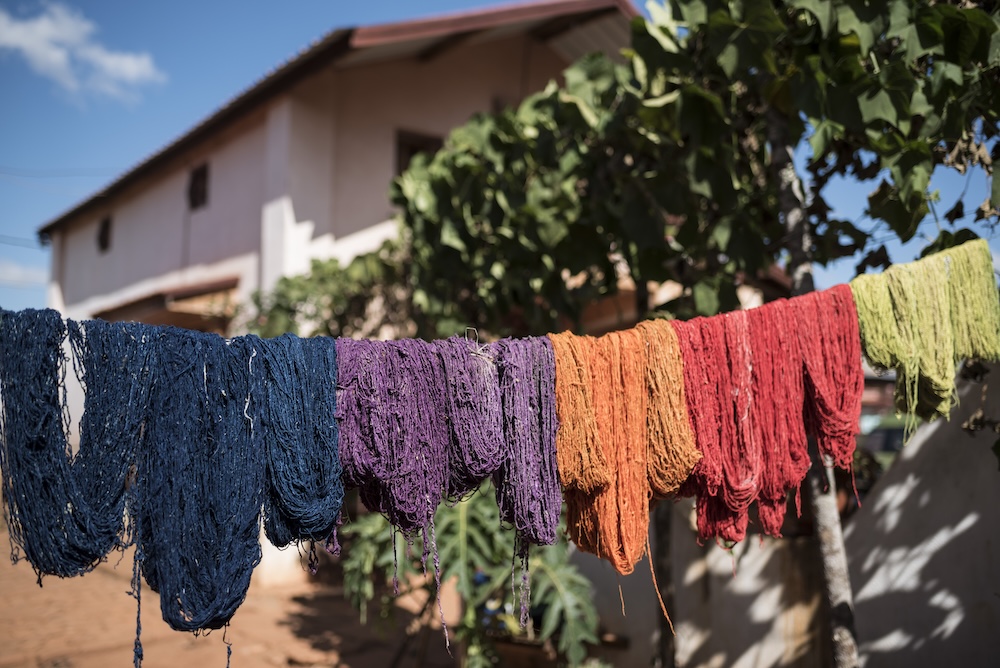 Dyed silk hanging out on a clothes line