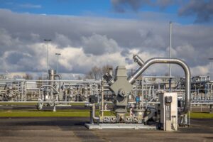 natural gas well with piping in the background