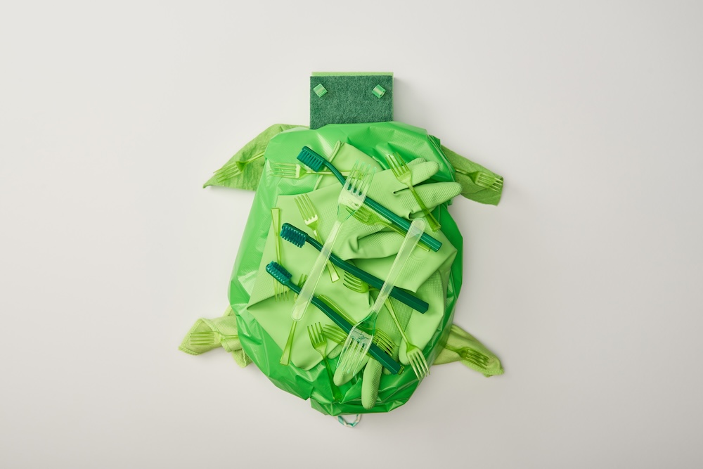 Green turtle made out of plastic disaposables