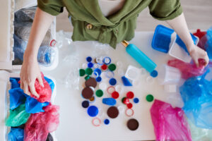 Person sorting plastics at home