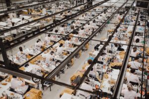 Textile sewing factory with rows of sewing machines
