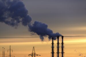 Factory with heavy smoke coming out of pipes