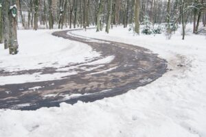 road after snow plow with de-icer